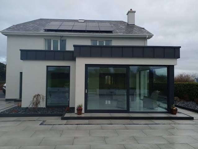 Rear extension with zinc cladding and aluminium sliding doors